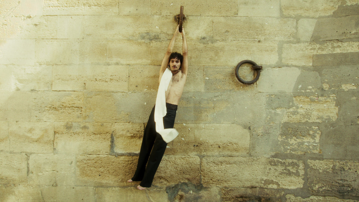 Adelina Bernard pre-campaign Like the Peeling of a Pomegranate man swinging with white silk