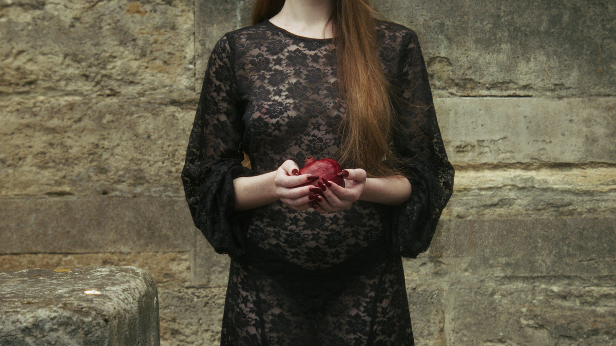 Adelina Bernard pre-campaign Like the Peeling of a Pomegranate Model holding Pomegranate