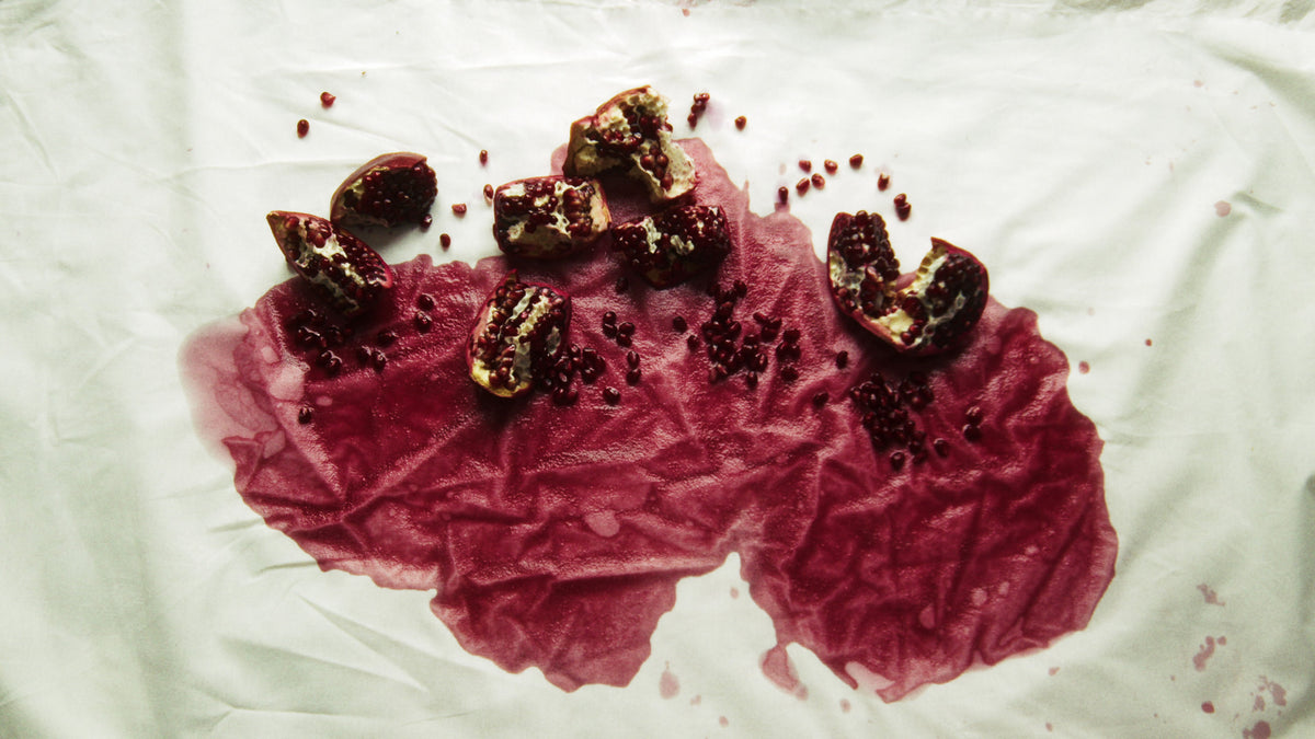 Adelina Bernard pre-campaign Like the Peeling of a Pomegranate broken pomegranates on white fabric
